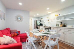 Four chairs are available as well as placemats, napkins, dishes, silverware