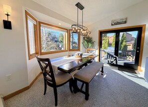 It seamlessly flows into the open-concept dining area, creating a warm and inviting space for gatherings.