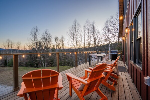 Experience breathtaking mountain views from our spacious deck! 
