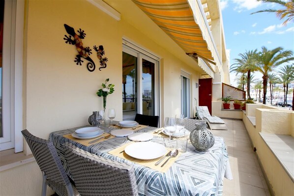 Large south facing terrace with outdoor dining area for four guests