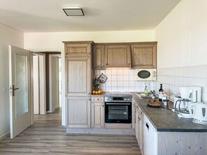 Cabinetry, Countertop, Kitchen, Kitchen Stove, Kitchen Appliance, Door, Home Appliance, Kitchen Sink, Wood, Interior Design