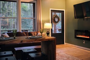 Living Room with Large screen TV and electric fireplace