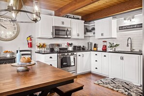 Open concept kitchen featuring a dining space.