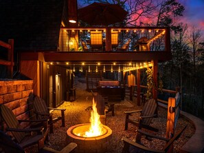 Gather around the fire pit, relax in the hot tub, or unwind on the spacious deck.