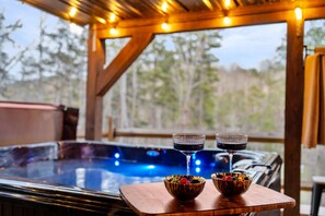 Enjoy a relaxing evening soak in our hot tub, surrounded by the soft glow of string lights and the tranquility of nature. The perfect way to end a day of adventure.