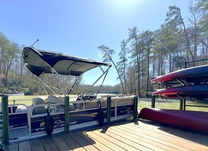 Experience Lake Adger in style! Inquire about renting our comfortable pontoon boat for an unforgettable day on the water (additional fee applies).