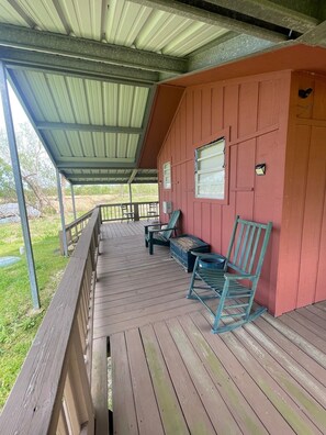 A picturesque front view of the Cozy Cajun Cabin, showcasing its inviting entrance and charming architecture.