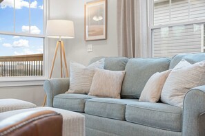The living room is a comfy space for everyone to gather together!
