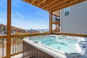 Soak your worries away in the hot tub on the lower back patio and soak in that view!