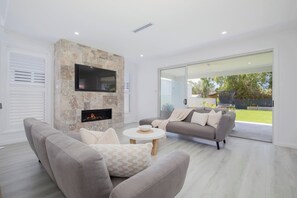Snuggle up by the fireplace for movie nights at home during the cooler months, or make use of central cooling in the summer.