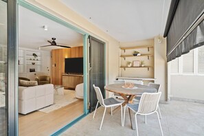 Dine alfresco or relax on the private patio, complete with outdoor furniture and an adjustable shade for your comfort.