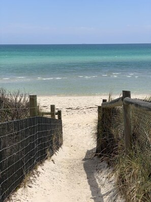 Footsteps from the beach, this family stay offers a peaceful, seaside location.