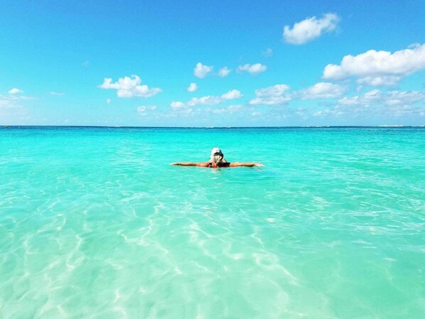 Does it get much better? Relax in the crystal clear water on 7 Mile Beach