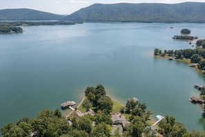 Landscaped yard gently descends to the lake, offering great views and space for entertaining.