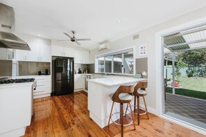 The kitchen is fully equipped for your holiday catering, with sleek appliances and cooking utensils.
