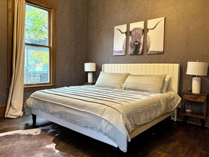 A luxurious king-size bed with plush linens.