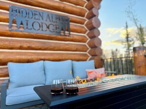 Enjoy the cozy couches on the main deck with mountain views.