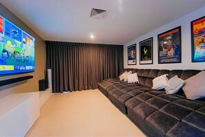 Private Cinema Room with 85 inch smart OLED TV with surround sound and streaming