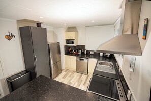 Kitchen with dishwasher and oven.