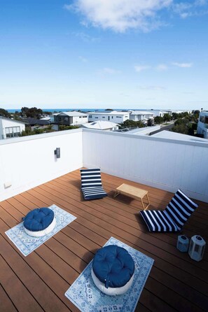 The rooftop terrace is the ultimate spot for relaxing, lounging on the pillows, stargazing at night, or enjoying the stunning ocean views 