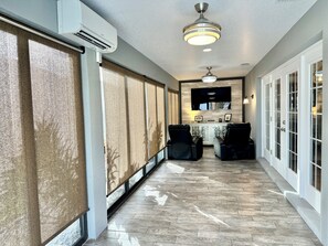 Screened-in Lanai with Darkening and Flatscreen TV