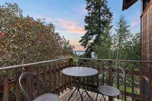 Just off of the kitchen, guests can enjoy the water and mountain views on the deck.