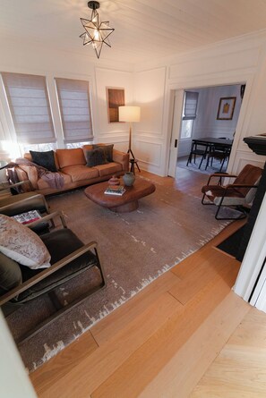 Cozy up in our rustic living room, where charm and comfort meet!