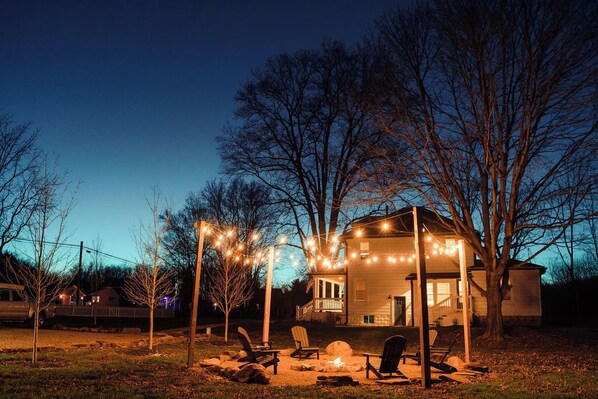 Twinkling lights, a cozy fire pit, and the perfect spot to unwind under the stars.
