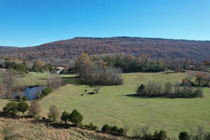 Views from the bedroom, living room and covered back porch:
- Lookout Mountain
- Sunsets
- Small Pond and A Few Cows Roam