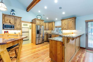 Beautiful, large kitchen with stainless steel appliances.