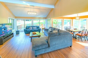 Family room is big and bright with a view out at Winterset ski trail.