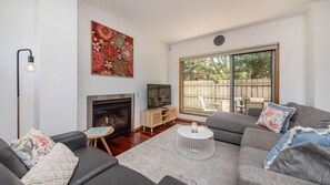cosy lounge area with gas fireplace 