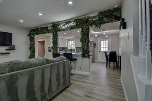 Unwind in the inviting living room featuring a cozy couch  #LivingRoomComfort