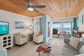 2nd Floor has the Primary Living Space with a comfortable, Gulf View living room with tons of seating around a 55" Smart TV!