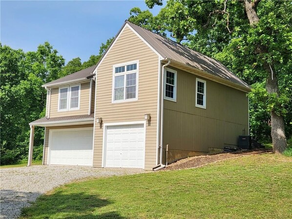 Welcome to Peaceful Pointe! Private drive take you to 9 acre getaway.