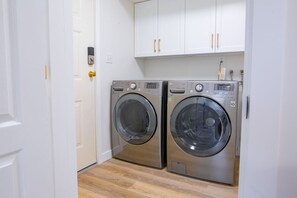 The shared laundry room offers convenient access to clean your clothes. Please note this space is shared with the other residents in the house.