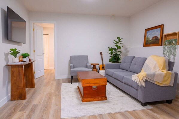 Relax in the bright, welcoming living space, complete with a 50" Samsung smart TV.