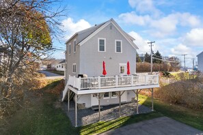 Large back deck with eating area and grill