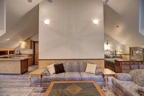 dining is left out of photo, then kitchen, bath behind couch, office on  
right 