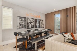 Gather in style around the spacious dining table, comfortably seating six guests for meals, games, or lively conversations. (Main Floor)