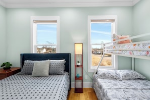 Queen bed, Full/Twin bunk, attached private bath. Perfect for families!