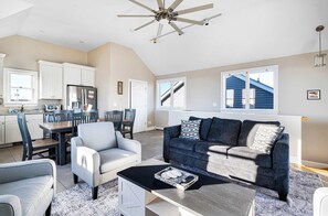 The top floor! This space features seating for 7, a dining table for 6 with additional foldable chairs, and updated kitchen with dishwasher