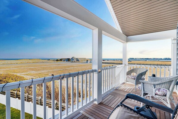 Expansive view of the ocean and the Hampton harbor outlet from the balcony.