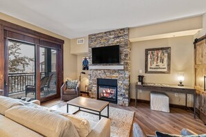 Modern furnishes, gas fireplace and TV to curl up with a movie to end your day!