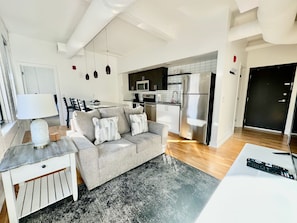 Living room with open plan to kitchen
