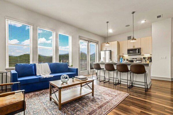 Spacious living room with stylish decor, perfect for unwinding after a day of exploring the local area.