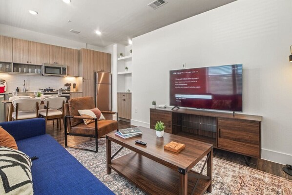 As you take a seat in the living room, the comfortable furniture and tasteful design make it easy to unwind.