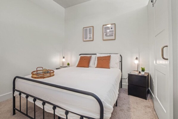 As you enter the bedroom, the sophisticated decor and plush bedding create a space where you can truly unwind.