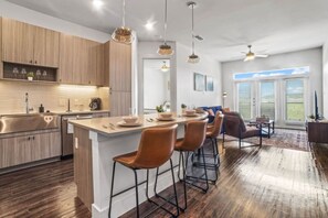 The dining room is bathed in natural light, creating a bright and inviting space where every meal feels special.