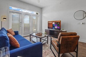 Spacious living room with stylish decor, perfect for unwinding after a day of exploring the local area.
